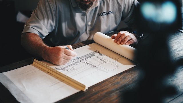 an architect working on a building drawing
