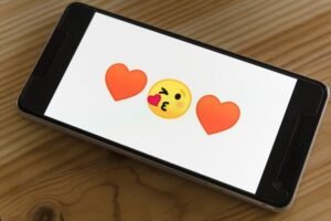 two love emojis on a cell phone