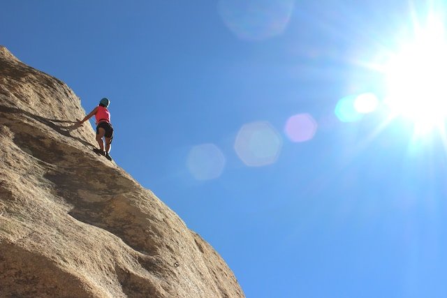 a person climbing a cliff